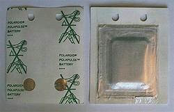 Figure 3. Flat and square Polaroid battery carefully removed from an empty film cartridge.   